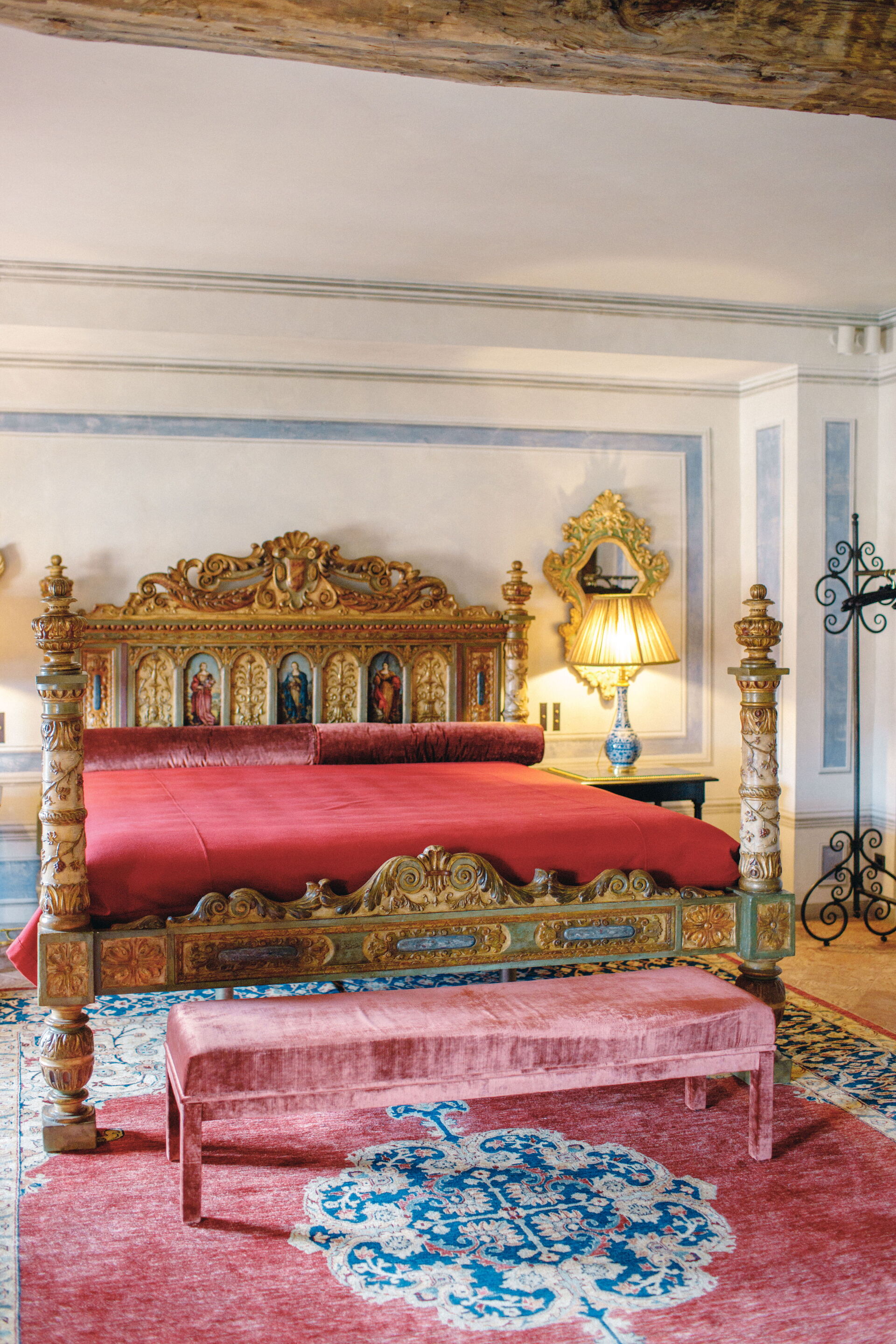 Villa Balbiano second floor red suite bedroom with carved gilt antique bed and red velvet linens