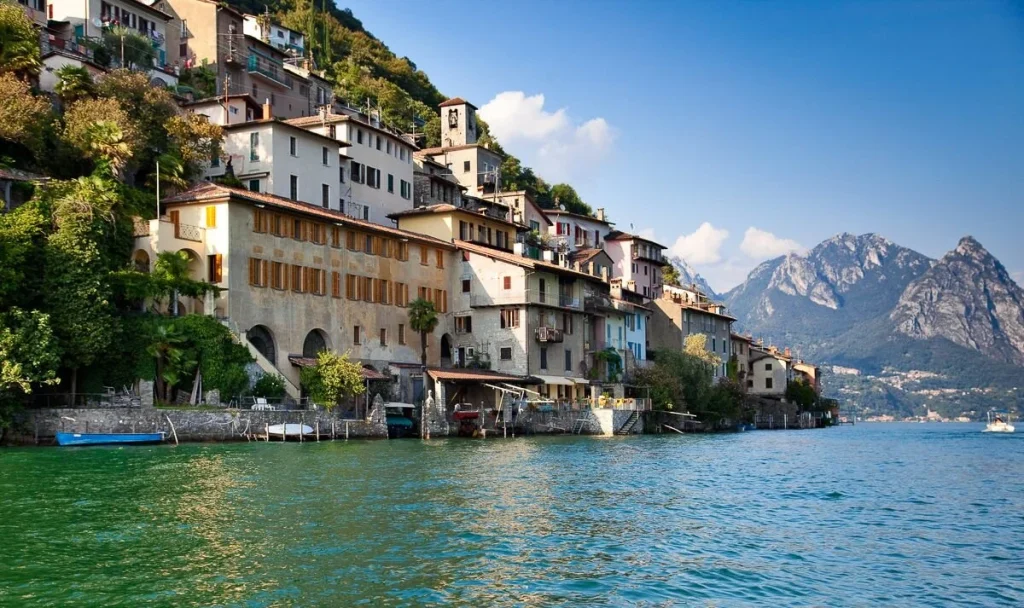 lakes-daytrips-lake-lugano-in-switzerland-view-on-shore-with-builldings.jpg