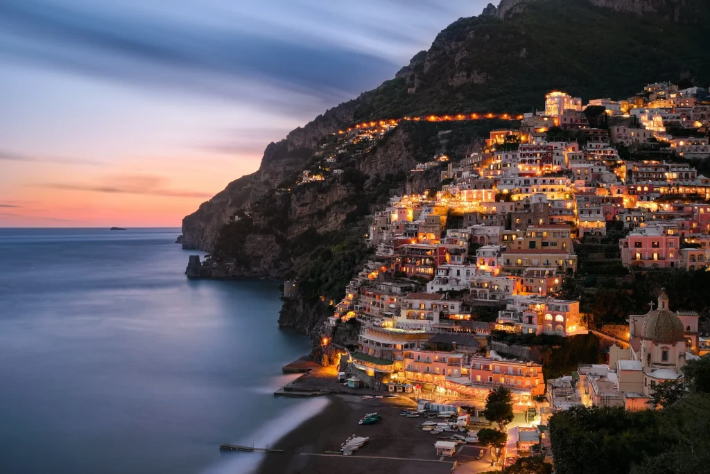 homes on the amalfi coast lit up at night