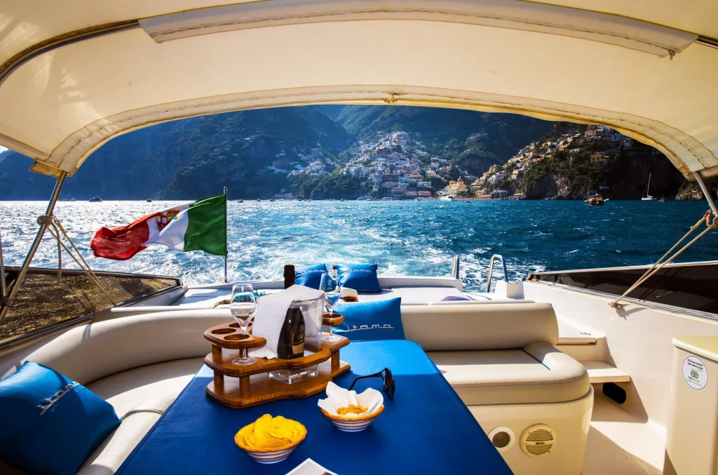 champagne and snacks aboard a private amalfi coast boat charter