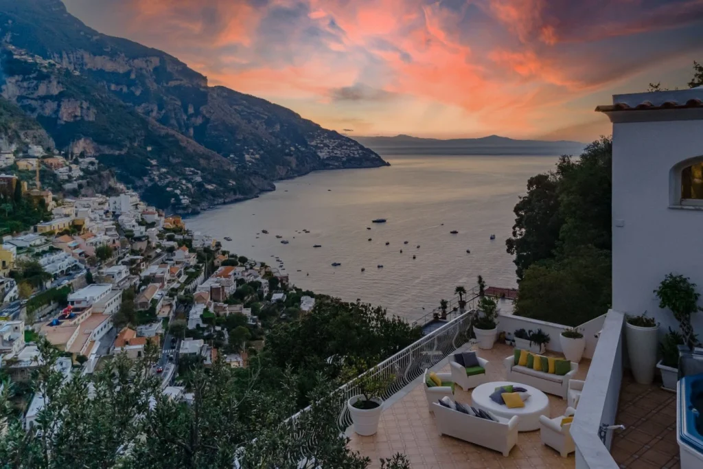 Villa Giulia — terrace at sunset over Positano and the Amalfi Coast
