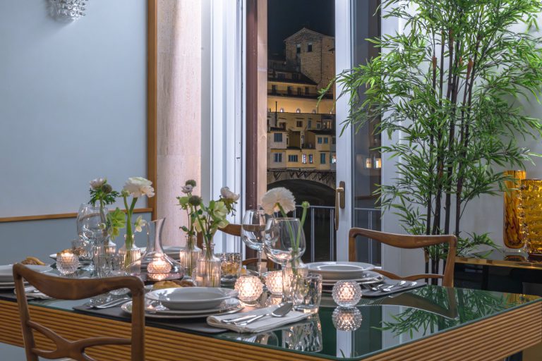 Villa Arnova, Florence — Dining table with the Ponte Vecchio at night