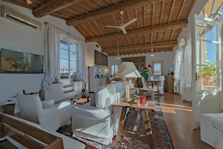 Villa Nau, Florence — Living room under beamed ceilings
