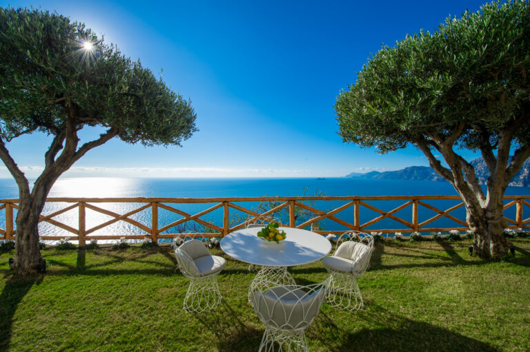 Villa Nuea — Olive trees, garden lawn, and the Tyrrhenian Sea