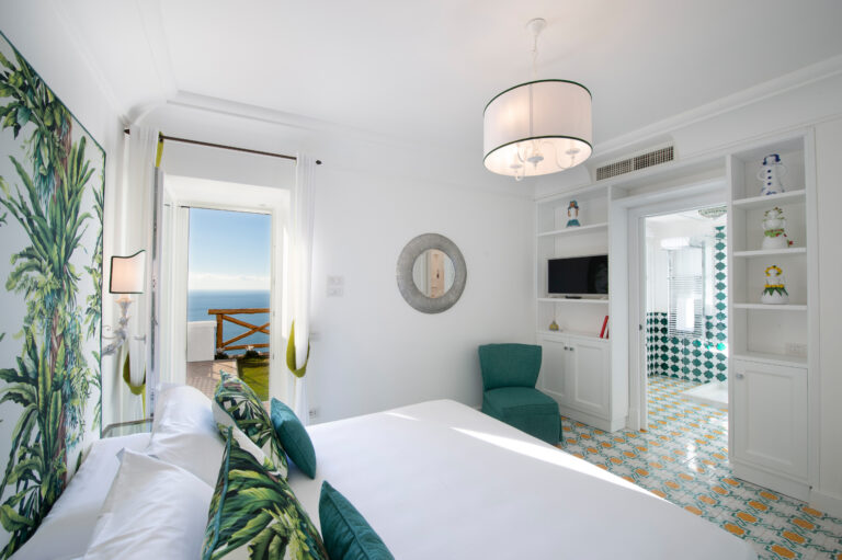 Villa Nuea — En-suite bedroom corner with blue tile detail